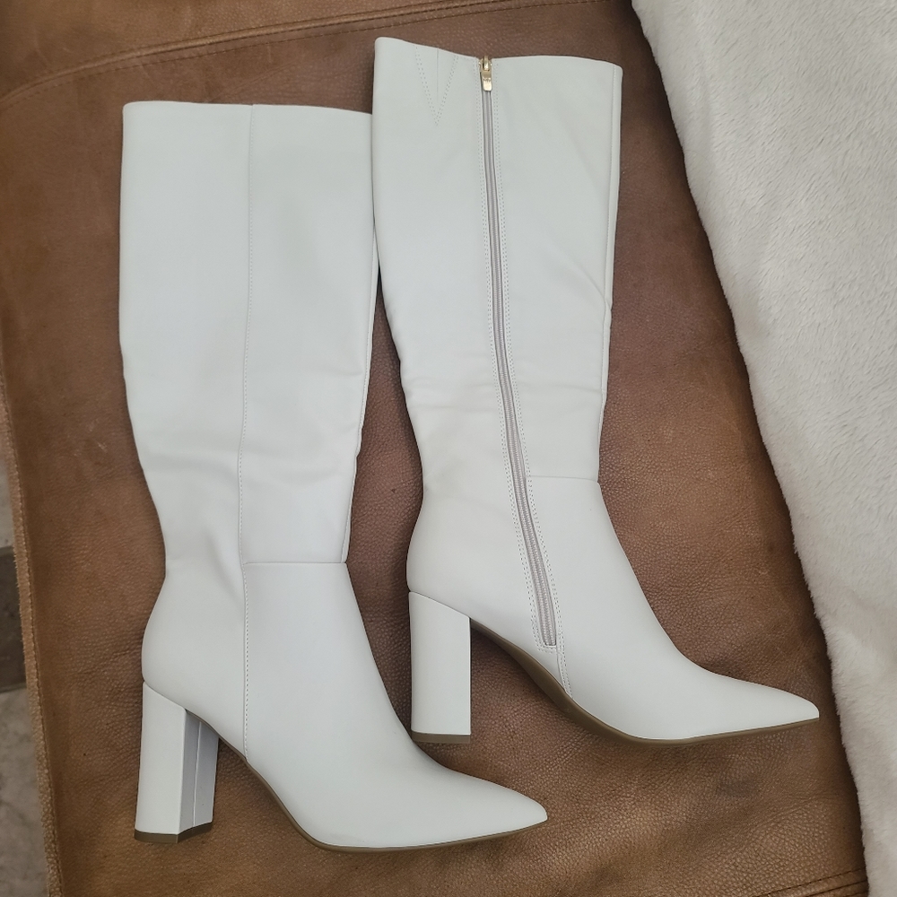 Knee high white boots.